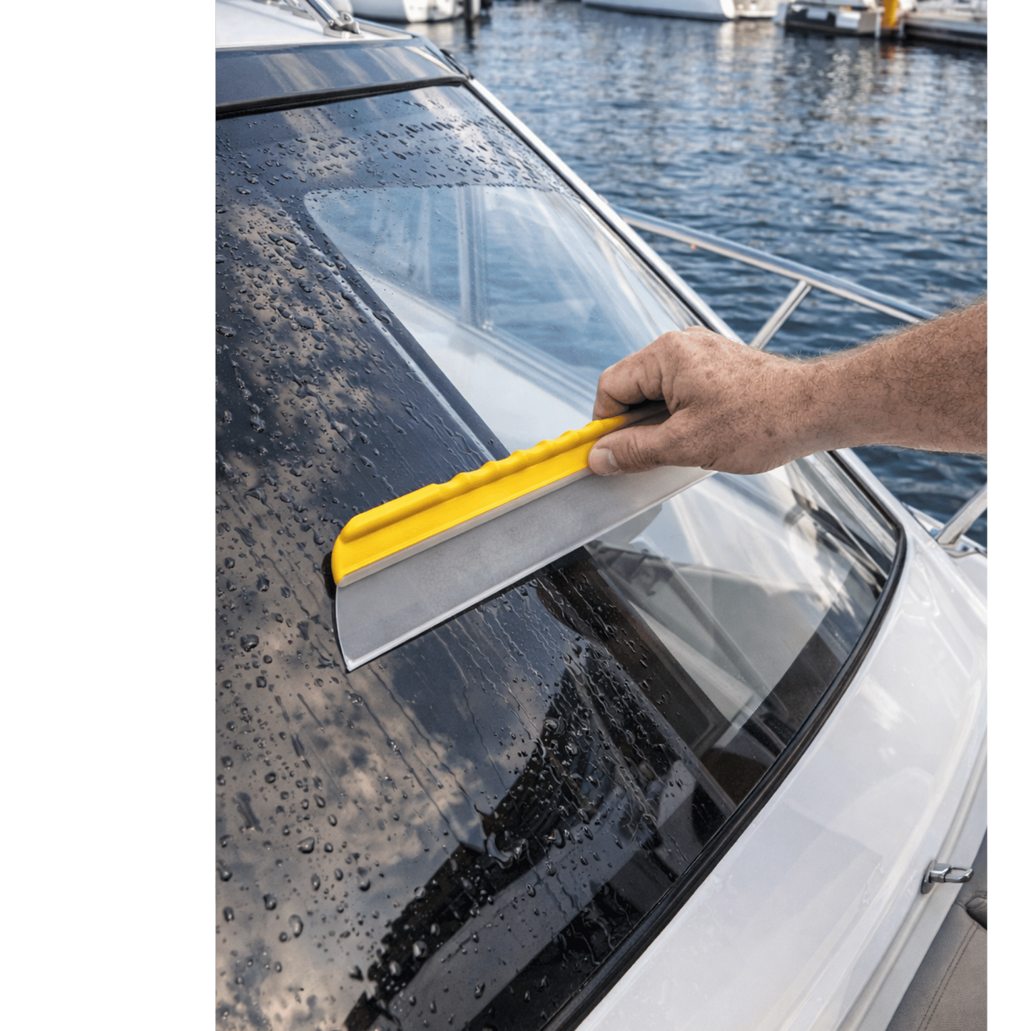 Deck Devil 12" aqua blade being used on a boat window to remove water NZ for the quickest and easiest way to dry smooth surfaces