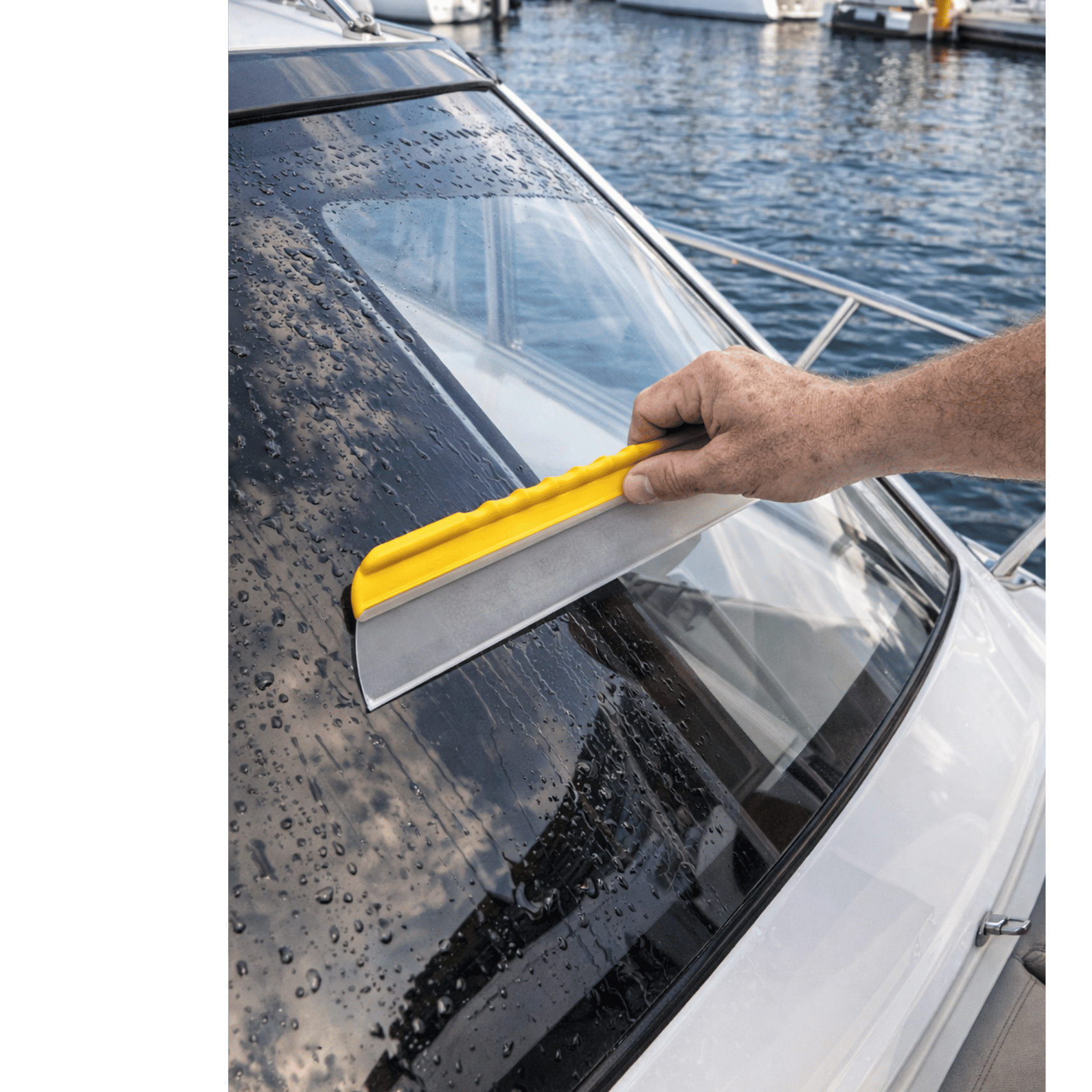 Deck Devil 12" aqua blade being used on a boat window to remove water NZ for the quickest and easiest way to dry smooth surfaces
